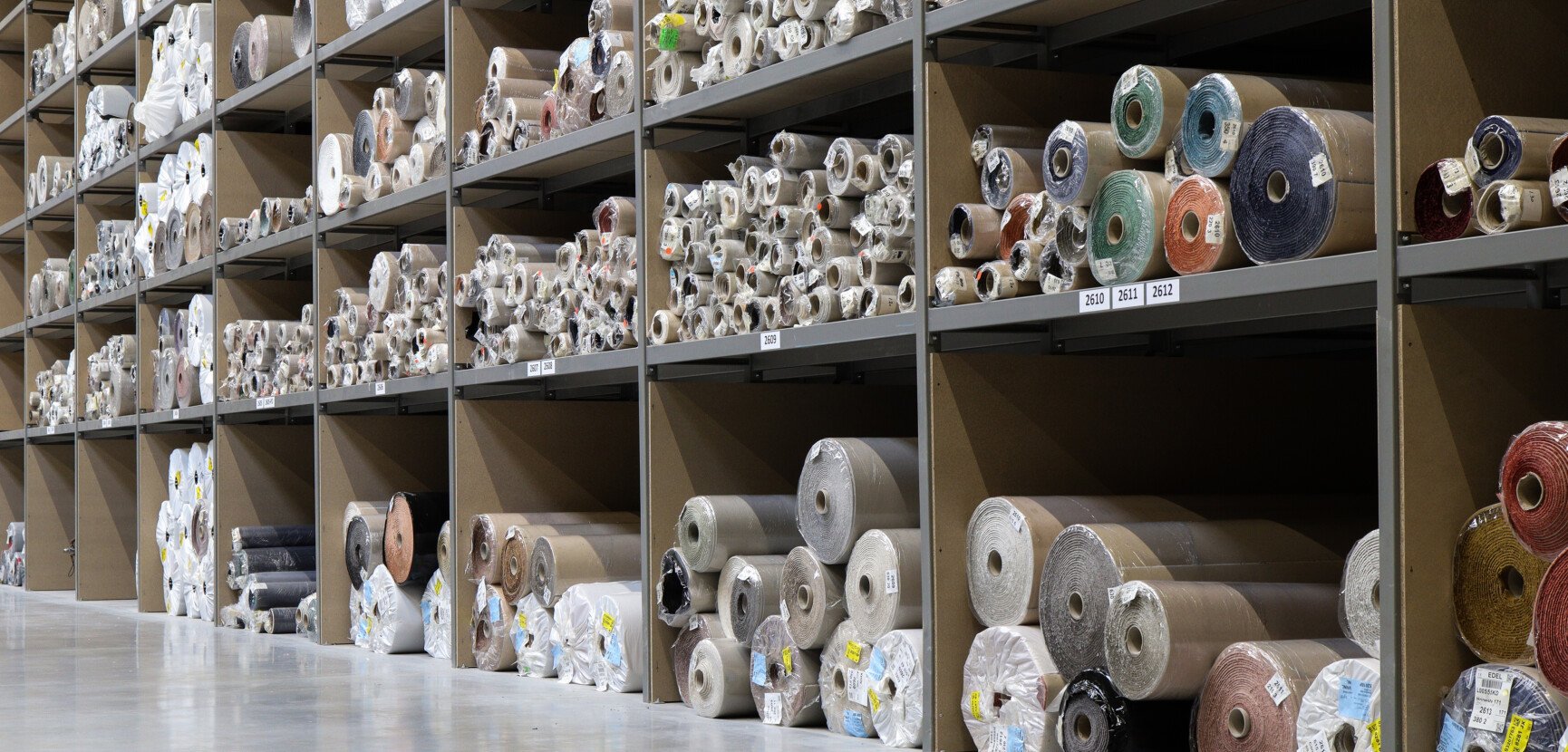 Carpet rolls stored in the Hillfloor Group warehouse